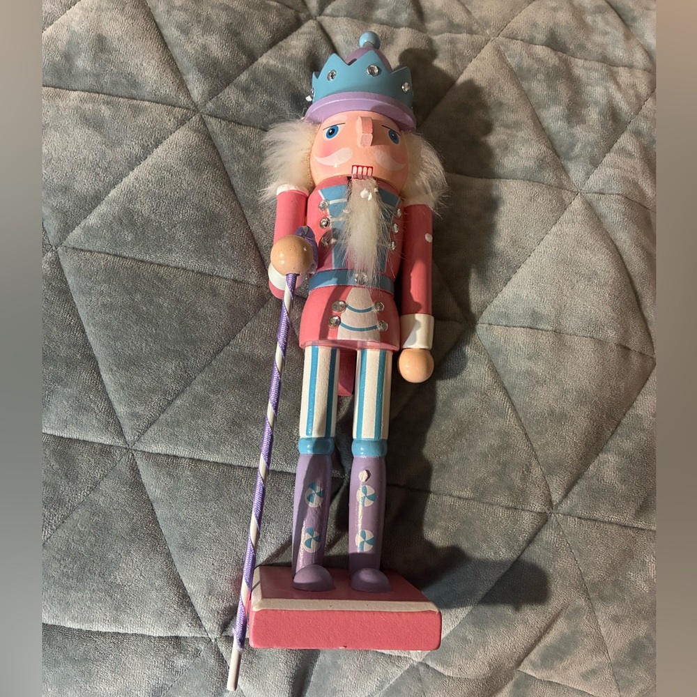 Adorable pink and pastel nutcracker figure, perfect for Christmas or year-round